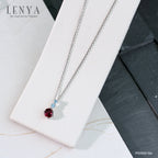 LENYA จี้เงินแท้ 925 ชุปทองคำขาว ประดับพลอย สีม่วงอมแดง โรโดไลท์ (Rhodolite) สวยโดดเด่น  และตกแต่งด้วยพลอยสีฟ้า บลู โทแพซ  ( Blue Topaz) ดีไซน์ น่ารักๆ