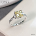LENYA แหวนเพชร DiamndLike สีแฟนซีทรง Princess เม็ดใหญ่ มาพร้อม คิวบิคเซอร์โคเนีย ที่บ่าข้างประกบเพิ่มความเปร่งประกาย ลงตัวกับเรือนเงินแท้ ชุบทองคำขาว เจิดจรัญทุกงานสำคัญ
