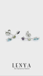 LENYA ต่างหูตัวเรือนเงินแท้ 925 ชุบทองขาว ประดับด้วยพลอย บลูโทแพซ(Blue Topaz) อเมทีสต์ (Amethyst) และ เพอริดอท(Peridot) สีสันสดใส ใส่แล้วน่ารัก ดูสวยไปกว่าเดิม