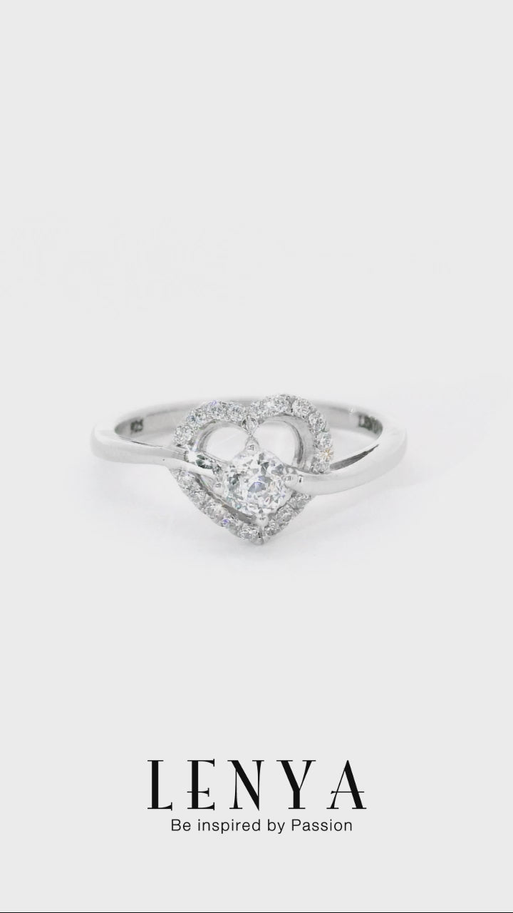 LENYA แหวนเพชร DiamondLike ดีไซน์รูปหัวใจล้อมเพชรเม็ดหลัก พร้อมชูเพชรเม็ดกลางให้โดดเด่นขึ้น ตัวเรือนเงินแท้ชุบทองคำขาว