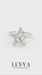 LENYA แหวนดีไซน์ปลาดาวน่ารัก ประดับด้วยพลอย บลูโทแพซ(Blue Topaz)  ตัวเรือนเงินแท้ 925 ชุบด้วยทองคำขาว และ พิ้งค์โกลด์ที่ขอบพลอยสวยงาม ไม่เหมือนใคร