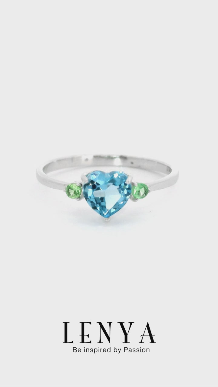 LENYA แหวนพลอยหัวใจบลูโทแพซ(Blue Topaz) สีฟ้า พร้อมด้วย ซาโวไรท์(Tsavorite) สีเชียวเม็ดเล็กสดใส ตัวเรือนเงินแท้ ชุบทองคำขาว เสริมรสนิยม สวยสง่า ดูดี